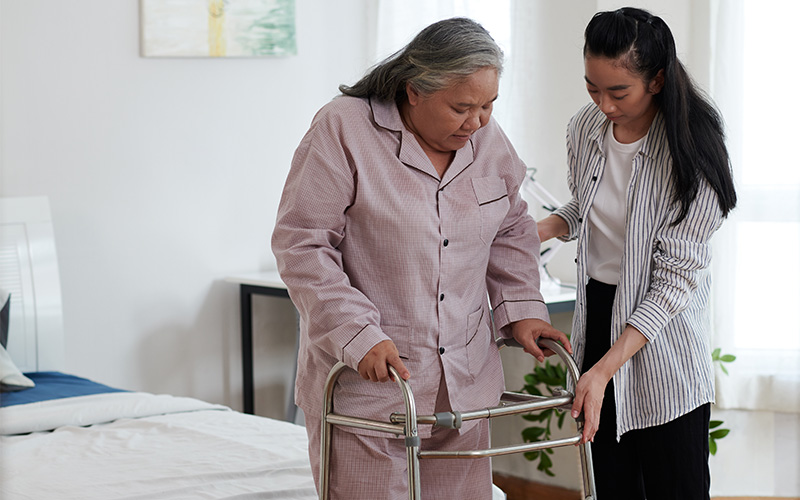 Senior Woman Using Walker